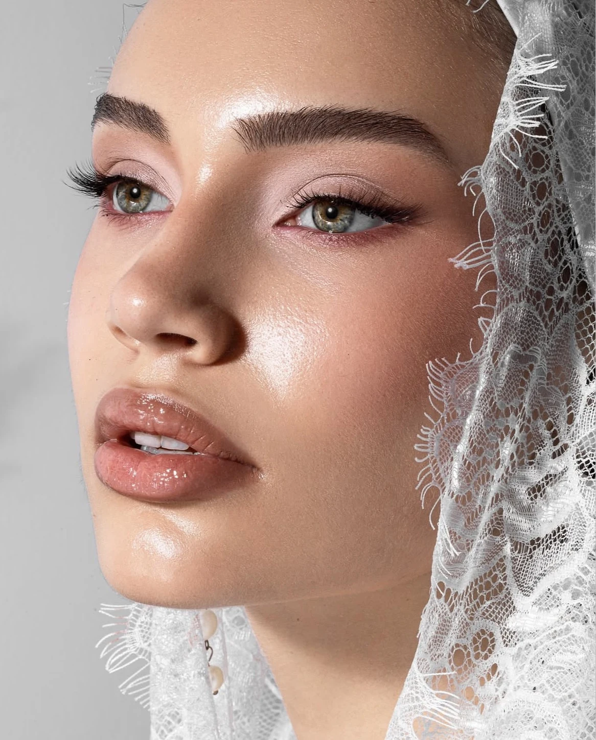 An intimate look at radiant skin and soft pink tones.